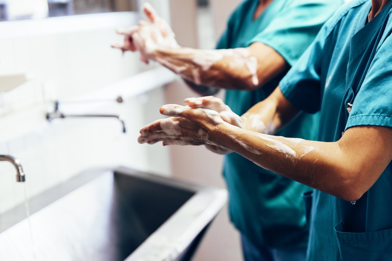 Foot Surgeon Perth - Podiatric Surgeon Perth - Surgeon Cleaning Hands
